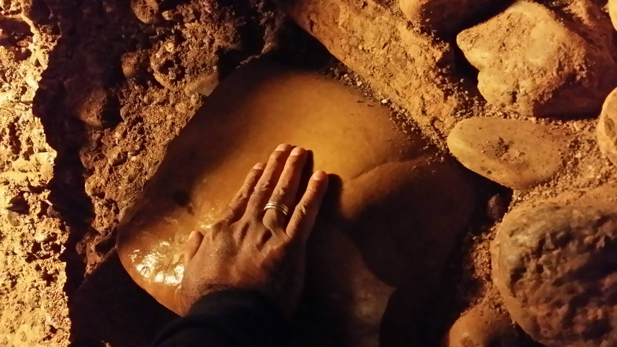 Mohanji touching the megalit in the labyrinth Ravne, network of tunnels around the pyramid